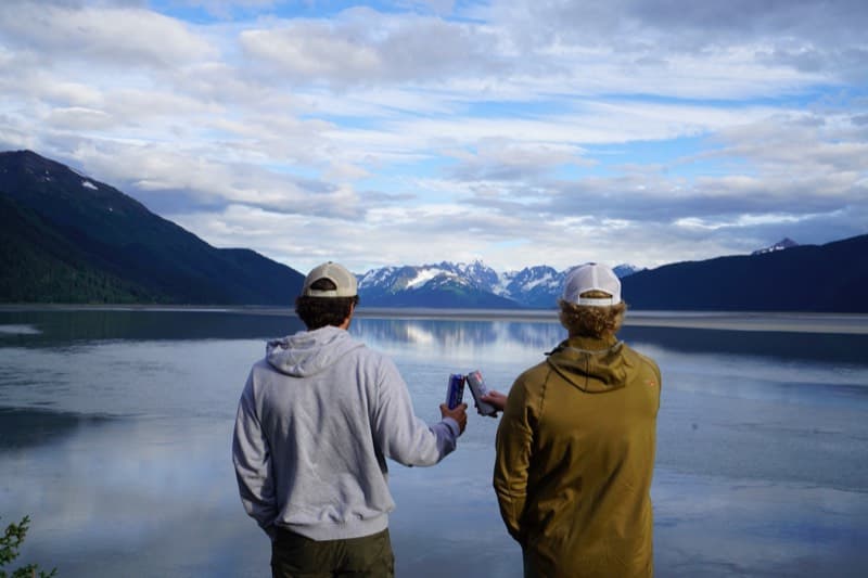 Cheers by the lake with mountains